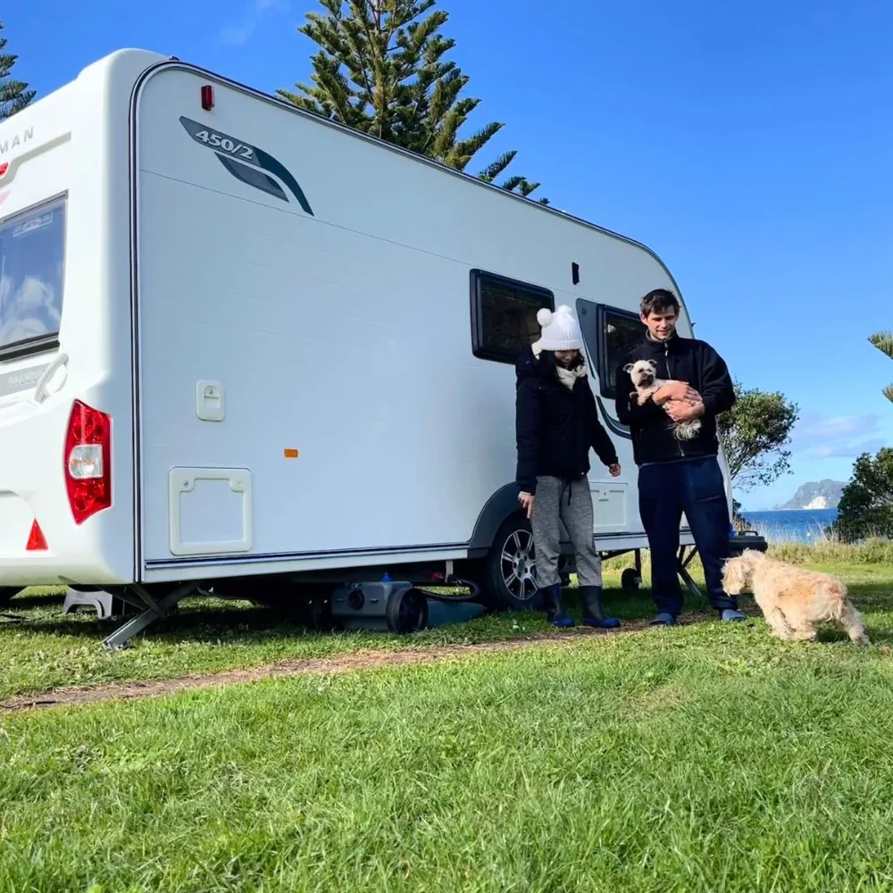 Linda near the ocean sculpture
